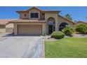 Charming two-story home featuring a well-manicured lawn, a two car garage and a terra cotta roof at 2340 W Myrtle Dr, Chandler, AZ 85248