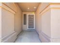 Covered entryway with decorative pillars and a security screen door at 2422 E Rockledge Rd, Phoenix, AZ 85048