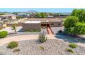 Aerial view of a single story home with desert landscaping, with mountains in the background at 2699 E Claxton Rd, Gilbert, AZ 85297