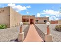 Front exterior of a single story home with long walkway and desert landscaping at 2699 E Claxton Rd, Gilbert, AZ 85297