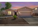 Charming single-story home featuring a three-car garage and desert landscaping at 4662 S Calico Rd, Gilbert, AZ 85297