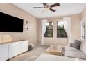 Cozy living room with neutral tones, large windows, and comfortable furnishings at 5302 E Van Buren St # 2024, Phoenix, AZ 85008