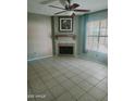 Living room featuring tile flooring and a fireplace at 5704 E Aire Libre Ave # 1038, Scottsdale, AZ 85254