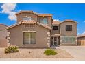 Charming two-story home featuring a well-maintained facade and low-maintenance front yard landscaping at 6118 S 46Th Ave, Laveen, AZ 85339