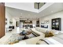 Open-concept living space with sleek furnishings, an adjacent kitchen, and abundant natural light at 6525 E Cave Creek Rd # 101, Cave Creek, AZ 85331
