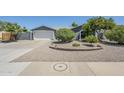 Charming home with a desert landscape, an attached two car garage, and a walkway to the front door at 696 W Mesquite St, Chandler, AZ 85225