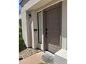 Charming front entrance with a stylish door and modern lighting at 7222 E Gainey Ranch Rd # 232, Scottsdale, AZ 85258