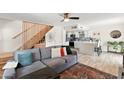 Inviting living room with modern furnishings, stylish decor, and staircase access at 841 E Peoria Ave # 2, Phoenix, AZ 85020