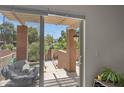 View from inside, showcases charming private outdoor patio, perfect for relaxation at 841 E Peoria Ave # 2, Phoenix, AZ 85020