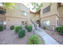 The exterior of the building features well-maintained landscaping and a cozy atmosphere at 15225 N 100Th St # 1185, Scottsdale, AZ 85260