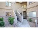 Charming exterior of the property with stairs leading to the upper level at 15225 N 100Th St # 1185, Scottsdale, AZ 85260