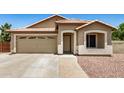 Charming single-story home showcasing a neutral color palette, well-manicured lawn, and attached garage at 1583 N Constellation Ct, Gilbert, AZ 85234