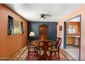 Traditional dining room with round wood table, china cabinet, and views to the kitchen at 2020 W Marshall Ave, Phoenix, AZ 85015