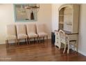 Bright dining room featuring hardwood floors and an elegant chandelier at 211 Bahia E Ln, Litchfield Park, AZ 85340
