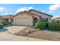 Charming single-story home showcasing manicured front yard, desert landscaping, and a two-car garage for comfortable living at 2432 W Oberlin Way, Phoenix, AZ 85085