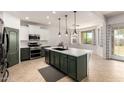 Modern kitchen featuring stainless steel appliances, a large island, and ample counter space at 278 S San Luis Rey Trl, Casa Grande, AZ 85194
