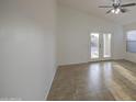 Spacious room with tile flooring and white walls, providing a neutral backdrop at 29384 N Rosewood Dr, San Tan Valley, AZ 85143