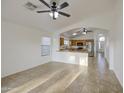 Bright living room area with tile flooring leading into the kitchen at 29384 N Rosewood Dr, San Tan Valley, AZ 85143