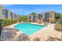 Beautiful community pool surrounded by lounge chairs and well-maintained landscaping at 2946 N 14Th St # 37, Phoenix, AZ 85014