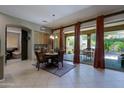 Bright dining room with sliding glass doors and a view of the outdoor patio and backyard at 4609 W Challenger Trl, New River, AZ 85087