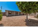 Inviting single-story home with a covered patio, low-maintenance landscaping, and mature trees at 544 S Crismon Rd, Mesa, AZ 85208