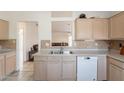 Classic kitchen featuring light cabinets, neutral countertops, and a stainless steel sink at 10305 E Dragoon Ave, Mesa, AZ 85208