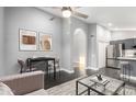 Cozy open-concept living area with kitchen access, modern furniture, and stylish decor at 1055 E Ingram St, Mesa, AZ 85203