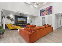Bright and airy living room with modern decor, fireplace, high ceilings and clerestory windows at 1807 E Campbell Ave, Phoenix, AZ 85016