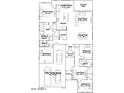 Detailed floor plan showcasing a spacious layout with a three-bay garage, owner's suite, kitchen, and an open-concept living area at 23008 E Roundup Way, Queen Creek, AZ 85142