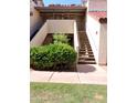 Condo exterior featuring a tidy garden, neutral colors, and easy access stairs at 30 E Brown Rd # 2113, Mesa, AZ 85201