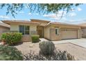 Inviting single-story home with a tile roof, desert landscaping, and a well-manicured front yard at 3310 W Chambers St, Phoenix, AZ 85041