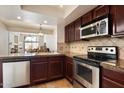 Updated kitchen with stainless steel appliances, granite counters, and tile backsplash at 4015 N 78Th St # 135, Scottsdale, AZ 85251