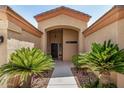 Inviting front entrance with mature sago palms and stone accents at 4345 E Annette Dr, Phoenix, AZ 85032