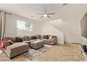 Cozy living room with a neutral color scheme, tile flooring, and a ceiling fan at 4807 W St Anne Ave, Laveen, AZ 85339
