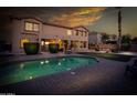 Resort-style backyard with a refreshing pool, tropical landscaping, and an inviting patio at 7156 S Forest Ave, Gilbert, AZ 85298