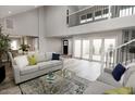 Open-concept living room with plenty of natural light, stylish furniture, and wood floors at 7840 N 7Th St # 15, Phoenix, AZ 85020