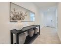 Bright entryway with modern decor, elegant mirror, and stylish console table at 8128 E Paloma Ave, Mesa, AZ 85212