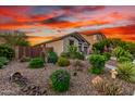 Attractive Southwestern landscaping featuring mature desert plants and rock ground cover at 12062 W Duane Ln, Peoria, AZ 85383