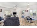 Bright living room featuring wood-look floors, lots of natural light and a comfortable seating arrangement at 14000 N 94Th N St # 1129, Scottsdale, AZ 85260