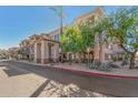 Beautiful condo exterior featuring desert landscaping, clean architecture, mature trees, and well-maintained grounds at 14000 N 94Th N St # 1129, Scottsdale, AZ 85260