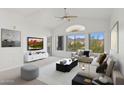 Bright living room with neutral decor, large windows offering scenic views, and modern furnishings at 14000 N 94Th St # 3198, Scottsdale, AZ 85260