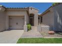 Charming front entrance featuring a covered walkway and a cozy desert-landscaped area at 1826 W Oriole Way, Chandler, AZ 85286