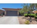 Single-story home with a two-car garage and desert landscaping at 18617 W Williams St, Goodyear, AZ 85338