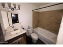 Bathroom with tub, toilet, and vanity sink at 2007 W Roeser Rd, Phoenix, AZ 85041