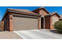 Charming single-story home with a well-maintained yard, and a two-car garage at 2391 S 171St Ln, Goodyear, AZ 85338