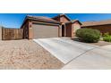 Charming single-story home with a well-maintained yard, concrete drive and a two-car garage at 2391 S 171St Ln, Goodyear, AZ 85338
