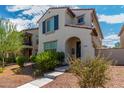 Inviting two-story home showcasing a stucco exterior, red tile roof, and a welcoming arched entryway at 2494 N Heritage St, Buckeye, AZ 85396