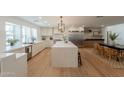Bright kitchen featuring an oversized island with a stone countertop and stainless appliances at 3651 N 49Th Pl, Phoenix, AZ 85018