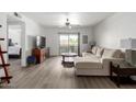 Spacious living room with modern flooring, neutral tones, and sliding door to a balcony at 4150 E Cactus Rd # 205, Phoenix, AZ 85032
