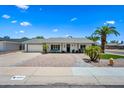 Charming single-story home with well-maintained landscaping and inviting curb appeal on a sunny day at 4252 E Zia St, Phoenix, AZ 85044